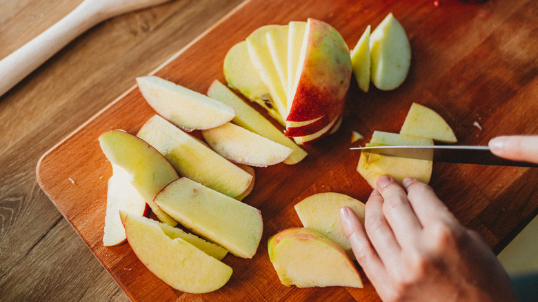 Person slicing apples