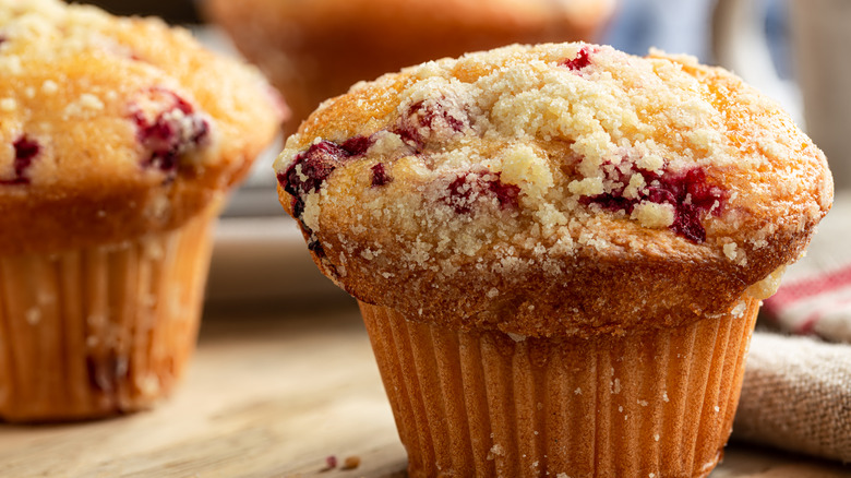 Cranberry muffins on table