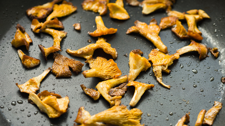 mushrooms cooking in a pan