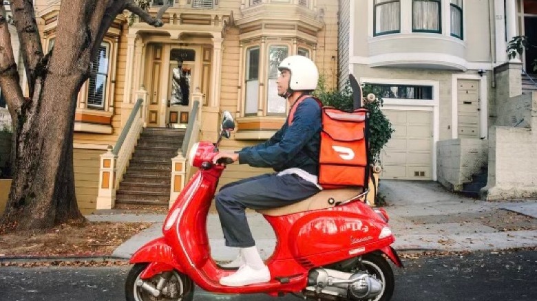 Door Dash delivery driver on motorcycle