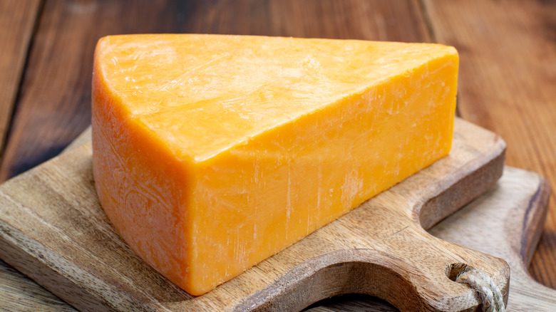 A wedge of cheddar cheese