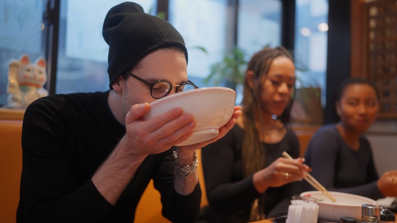 Customer drinking out of bowl