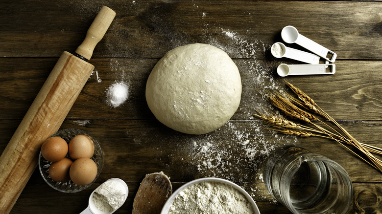 breadmaking ingredients on wooden table