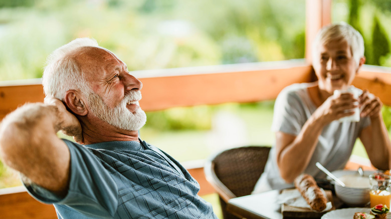 Couple relaxes while eating breakfast