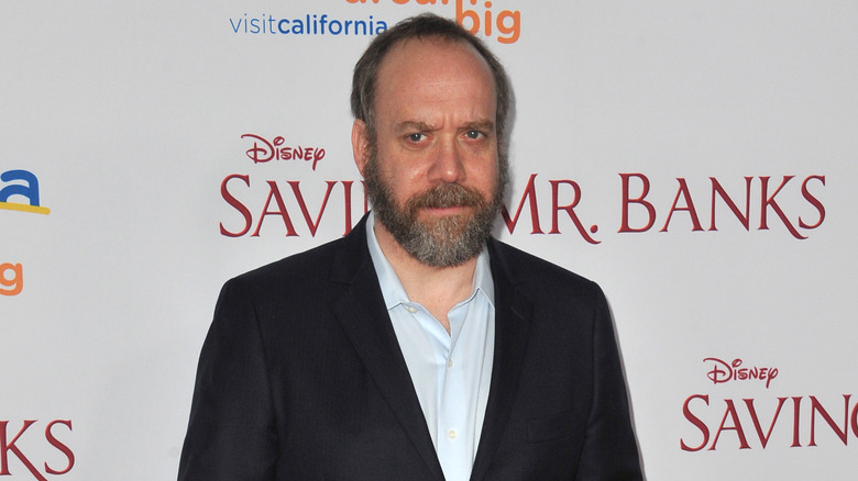 Paul Giamatti looks concerned in suit and white shirt