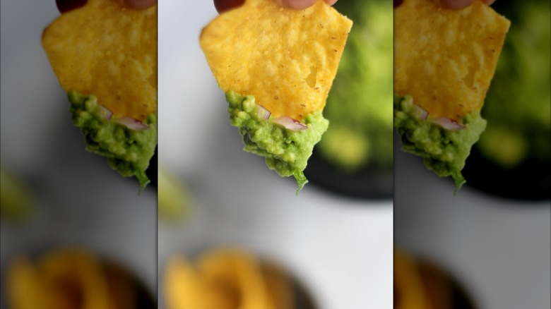 Tortilla chip with guacamole