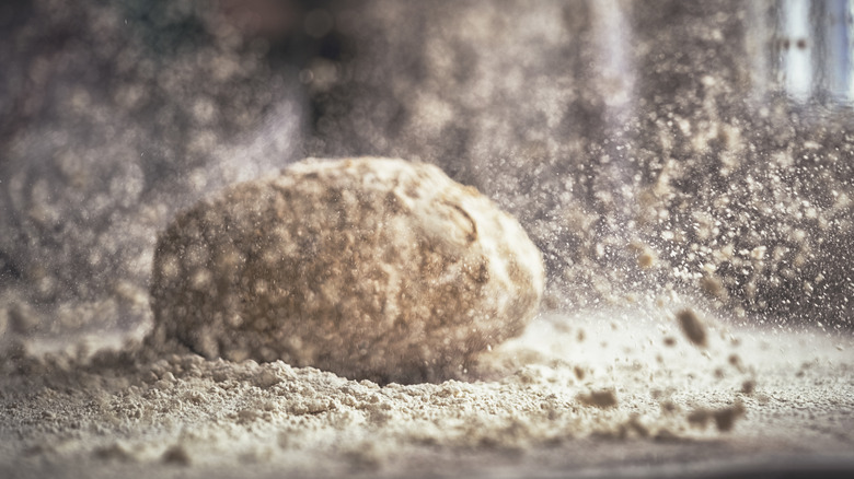 dough ball and flour on counter