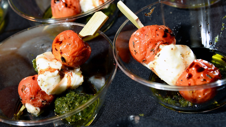 tomato and mozzarella on skewer with pesto