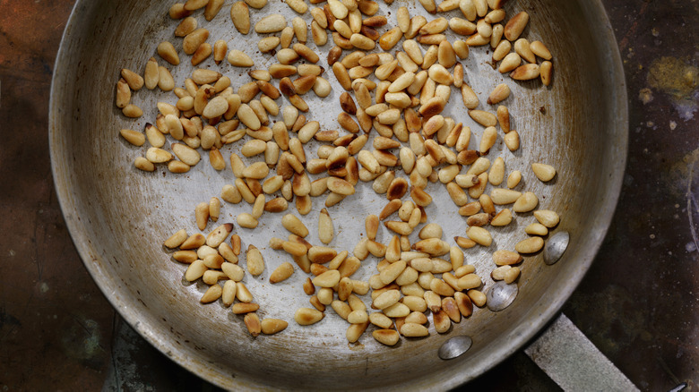 pine nuts toasting in pan