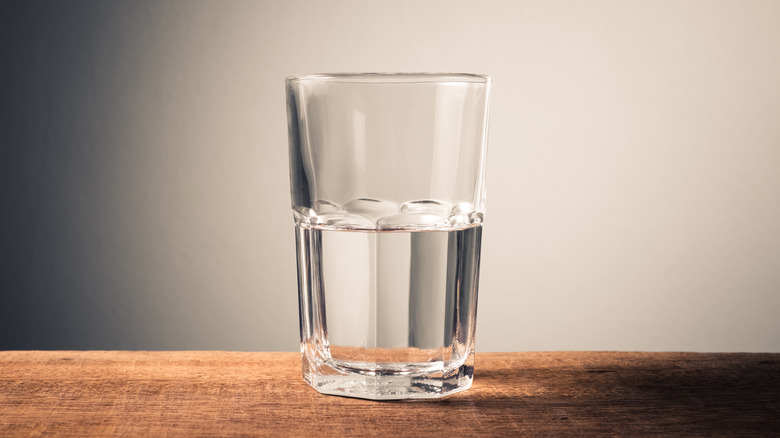 water in a clear glass on table