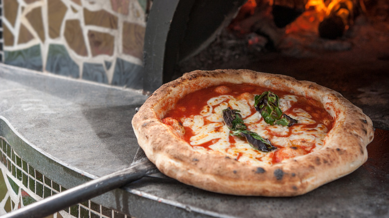 pizza on a pizza peel 