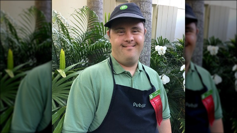 Publix employee wearing hat and apron