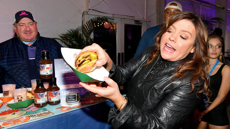 Rachael Ray with a burger