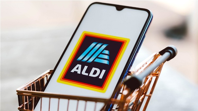 Aldi logo on iphone in miniature cart