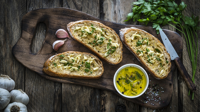 garlic bread of rustic wooden board