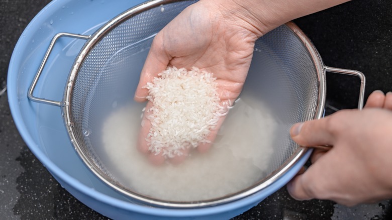 Rice being rinsed