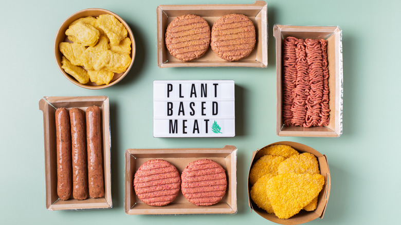 Array of raw plant-based meats in brown containers