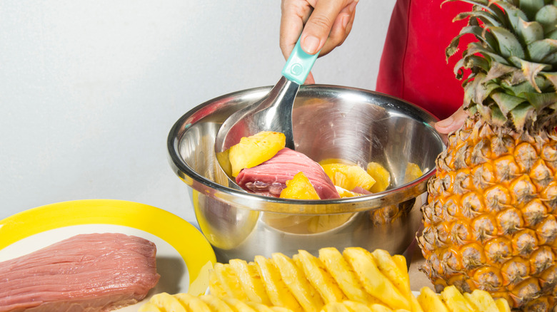 Pork marinating in pineapple mix