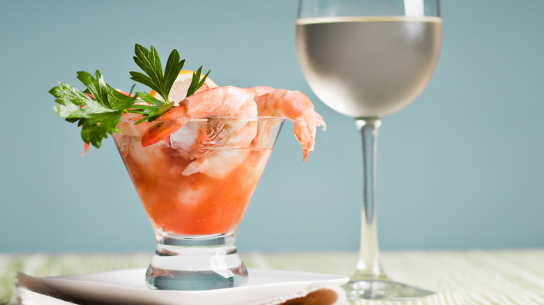 Shrimp cocktail with glass of white wine