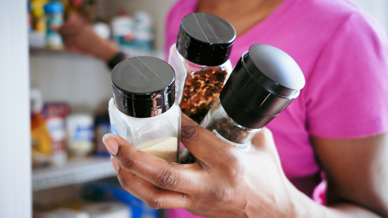 woman holding spices