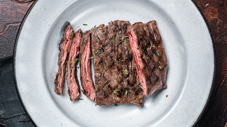 skirt steak in white bowl