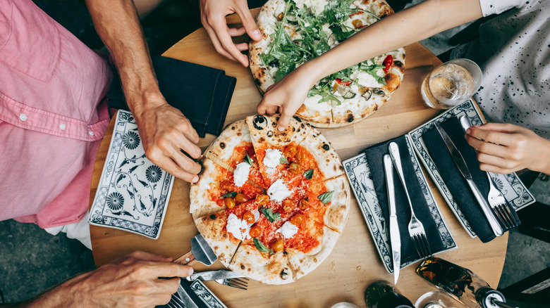 Family sharing pizza