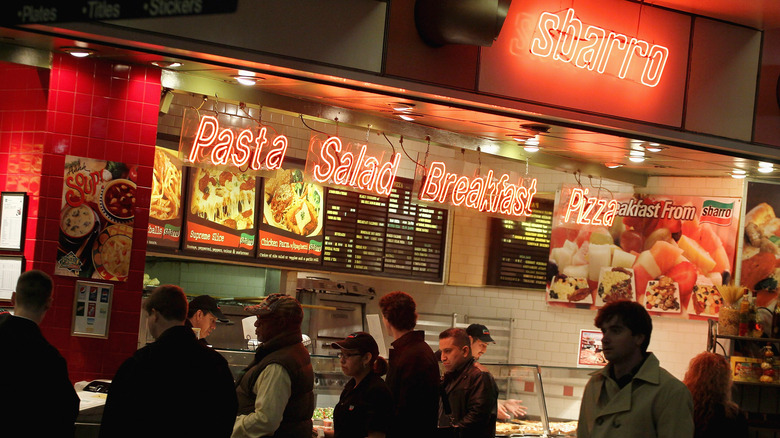 People lined up at Sbarro in food court