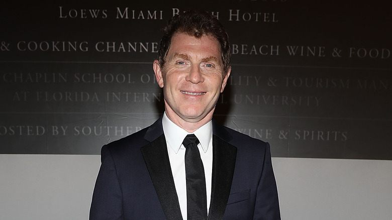 Bobby Flay dressed in a black suit