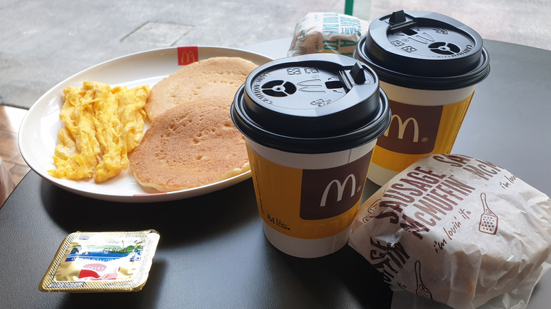 McDonalds coffee, pancakes, eggs, and egg McMuffin