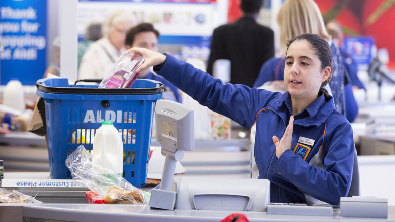 Aldi traditional checkout lane with cashier