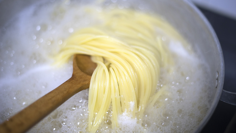 spaghetti cooking in pot