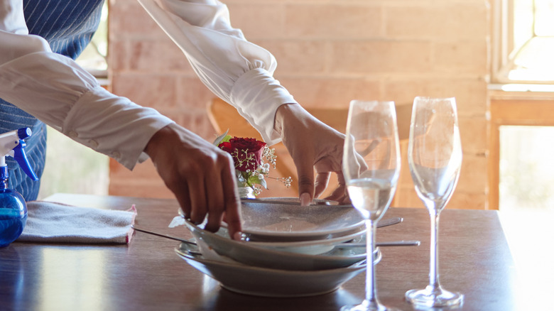 waitstaff clearing table