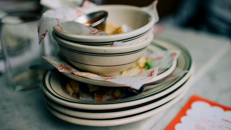 Stacked plates with leftover food