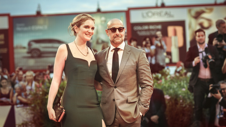 Stanley Tucci and wife Felicity posing