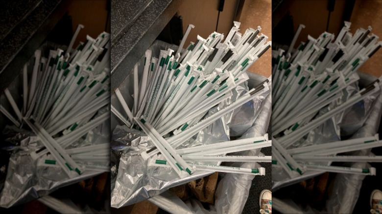 Starbucks straws thrown in trash