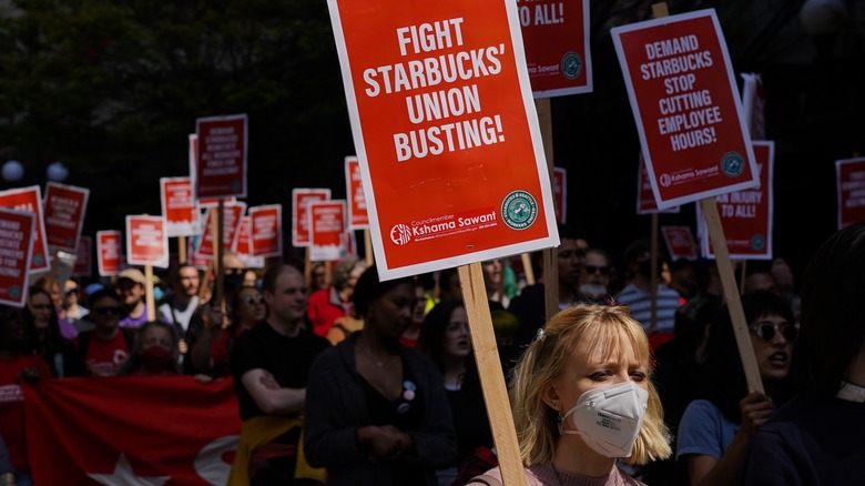 Starbucks Union Supporters holding signs