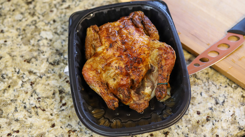 rotisserie chicken in a plastic open tray