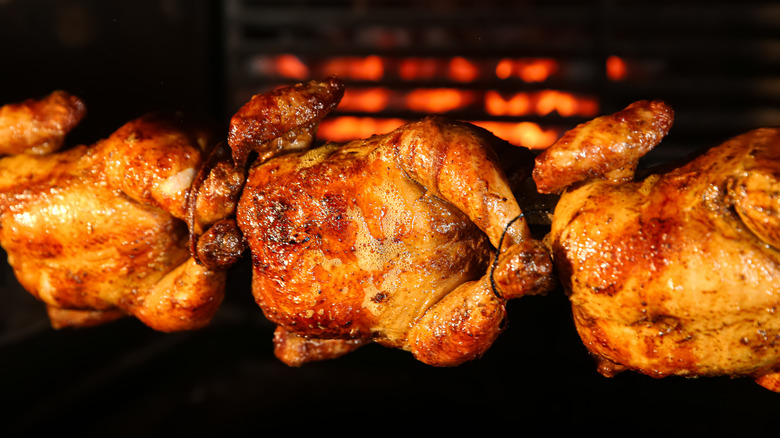 browned rotisserie chicken with grill 