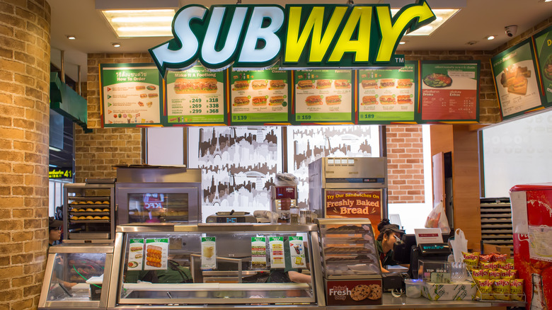 A Subway counter and menu