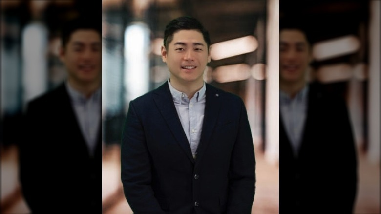 Young Chang in suit for portrait