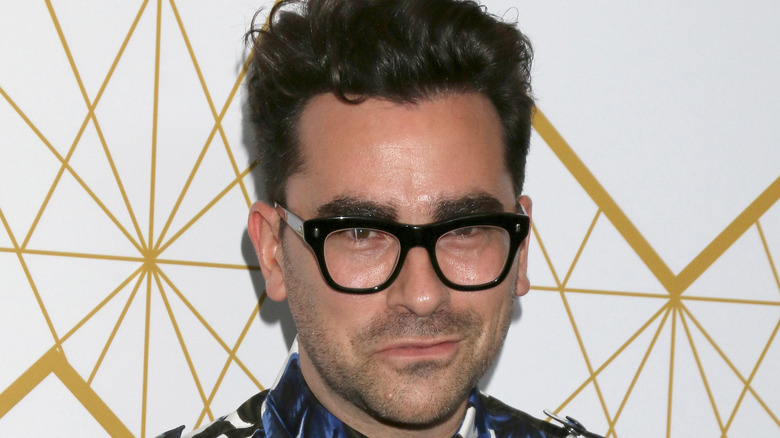 Close-up of dan levy's face