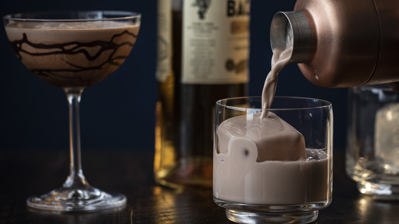 A chocolate martini being poured into a glass