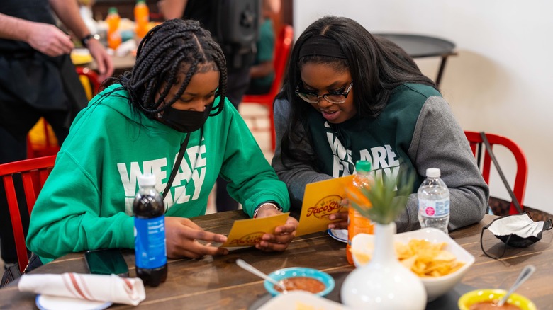 Two customers at the Old El Paso Taco Shop