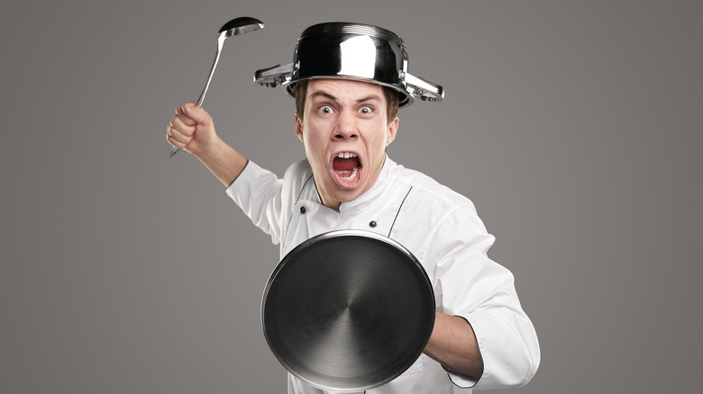 angry chef waving ladle