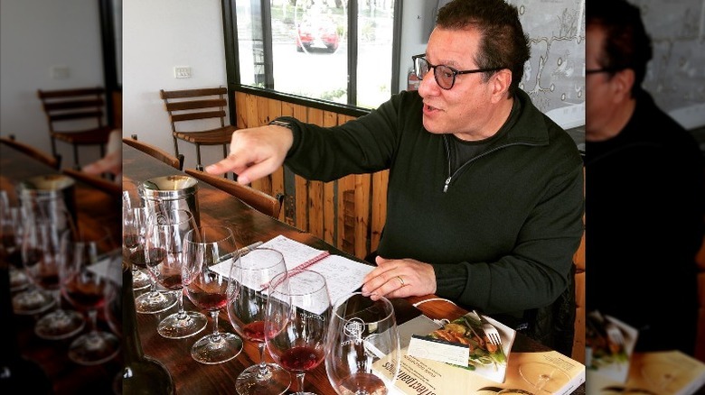 Master Sommelier Evan Goldstein pointing