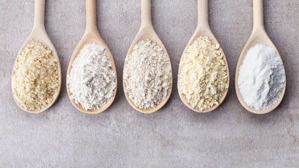 different kinds of flour on wooden spoons