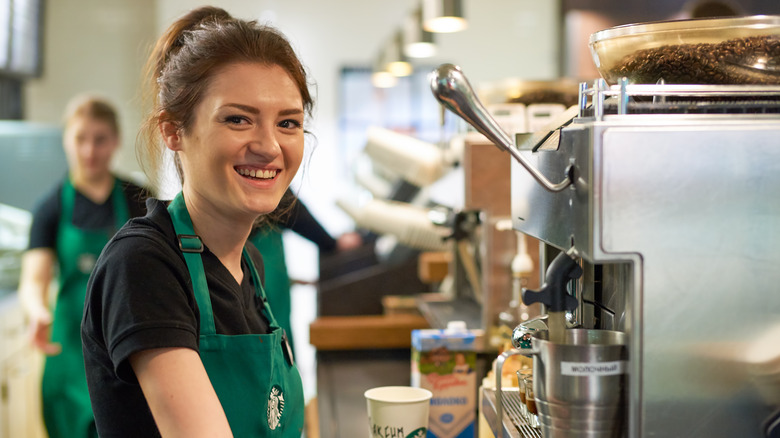 Starbucks worker smiles