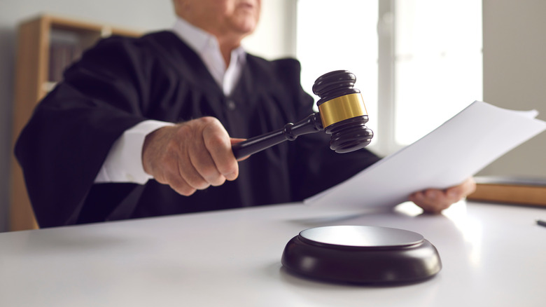 A judge pounding a gavel