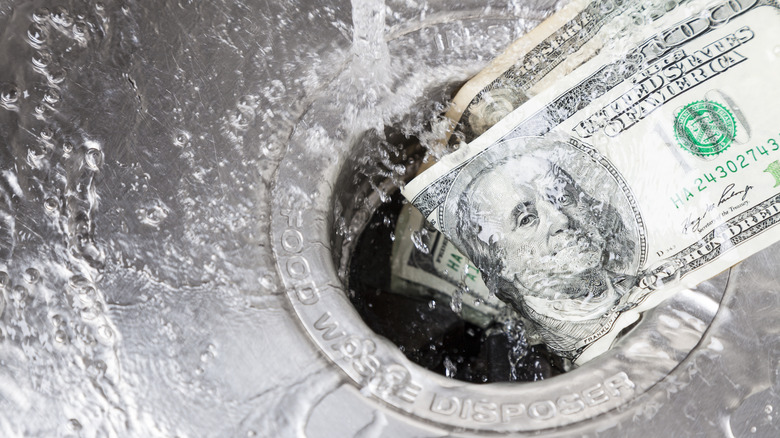 cash washing down the drain 