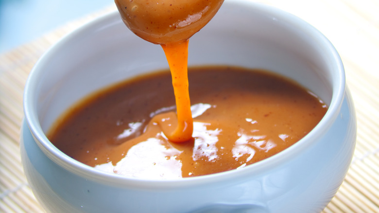 Cajeta being poured into a bowl